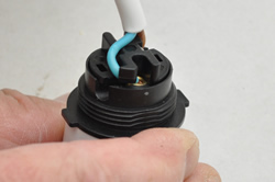 Flex conductors retained by lugs